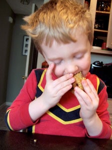 Banana Oatmeal Cups with Chocolate Chips - Toddler eating