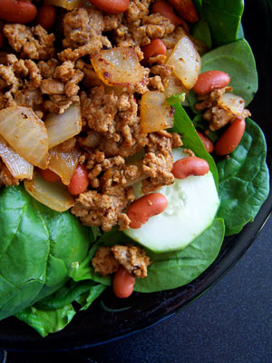 Spinach Salad topped with Curried Turkey