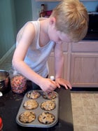 the toddler baking muffins 3