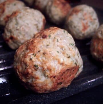 Homemade turkey meatballs on broiler pan