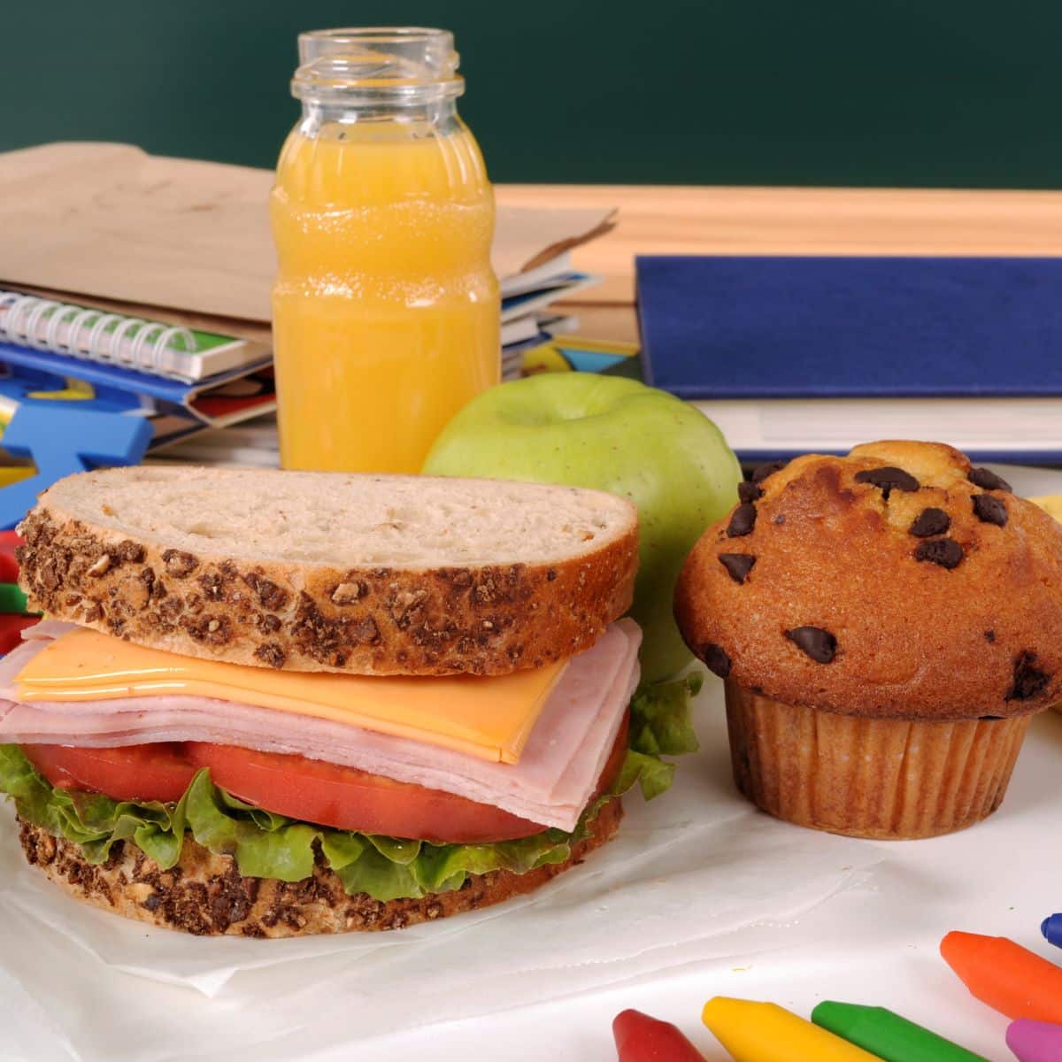 School lunch box with sandwich and thermos of juice on table. Ready for  school. Stock Photo