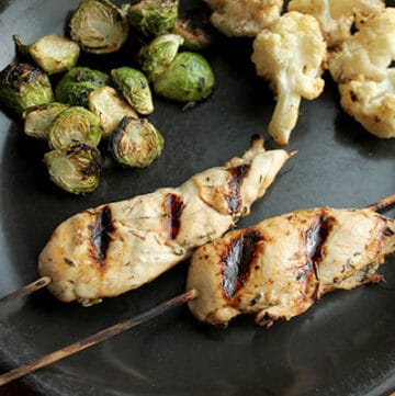 Citrus Thyme Chicken on a Stick with Grilled Brussels On Plate