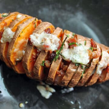 Finished Hasselback Sweet Potato With Cheddar, Chives and Bacon