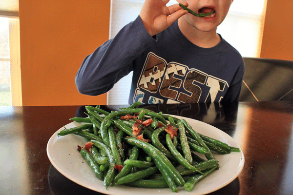 8 year old eating bacon green beans