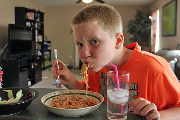 9-year-old eating shrimp and spaghetti 