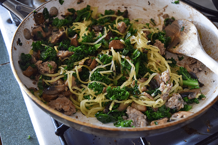 Spaghetti Squash added to the skillet with kale, mushrooms and sausage 