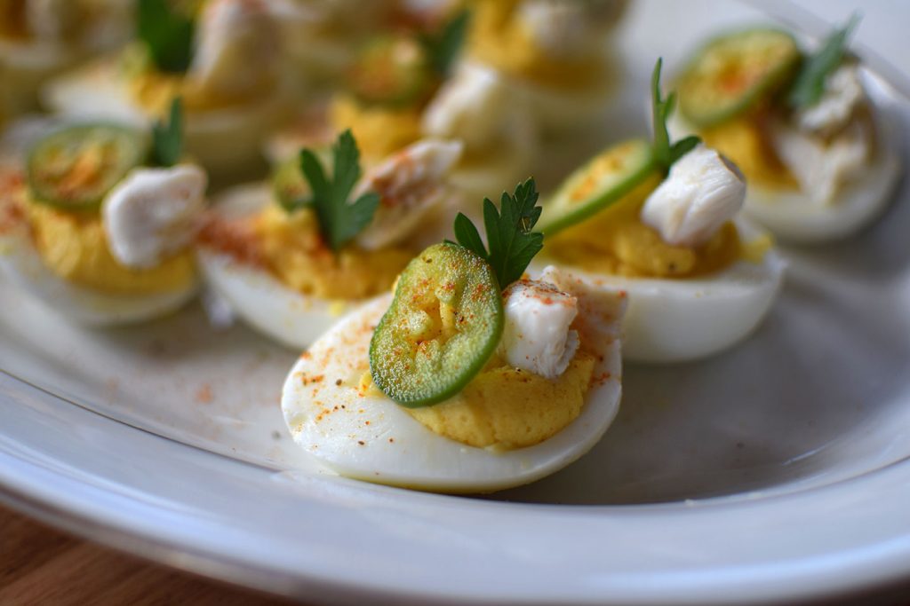 Crabby Deviled Eggs with pickled Jalapeno 